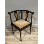 A reproduction mahogany finish corner chair with inlaid decoration