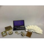 Cased set of drawing instruments, silver covered miniature prayer book, magnifying glass, musical