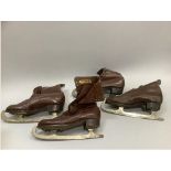 Two pairs of brown leather boots and ice skates