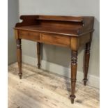 A 19th century mahogany wash stand having a three-quarter gallery above two drawers to the apron and