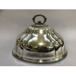 An early 20th century silver plated meat cover of oval lobed form with beaded handle and rims,