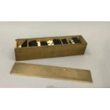 Bone and ebonised dominoes in wooden box