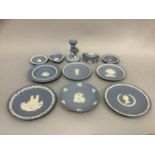 A collection of Wedgwood blue Jasper ware including commemorative and other plates, trinket box,