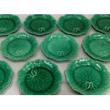 A set of ten Wedgwood green glaze leaf moulded dessert plates