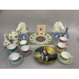 An Austrian china harlequin set of six coffee cups and saucers, a Doulton individual teapot, sugar