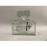 A Factice Guy Laroche Fidji glass perfume bottle, 17cm high by 16.5cm wide, moulded with Parfums,