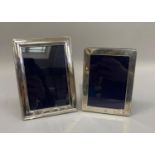 Two silver photograph frames, hallmarked London and Sheffield, approximately 15cm by 12cm and 18cm