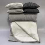 A bed throw in back and white ribbed fabric, superking size, together with a pair of matching