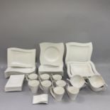 A Villeroy and Boch New Wave dinner service comprising eight dinner plates 33cm by 23cm, seven pasta