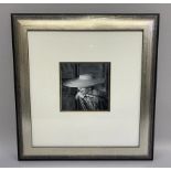 A pair of vintage black and white fashion photographs in silvered frames, measurement including