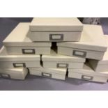 A set of ten cream storage boxes with window slots, measuring 33cm x 24cm x 8cm