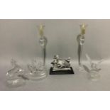 A pair of glass candlesticks, three glass animal and bird figures and a resin figure of a charioteer