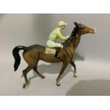 A Beswick race horse with jockey up, number 24