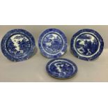 Three 19th century Pearlware blue and white willow pattern plates, 24cm and 21cm, together with