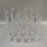 A suite of Royal Brierley glasses, the funnel shaped bowls with long stem, riven cut and etched with