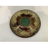 A Victorian rosewood and cut brass stand of circular outline the dished border applied with