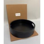 A Byron and Brown dark brown leather circular tray with finger grips, 31.5cm diameter by 8cm high