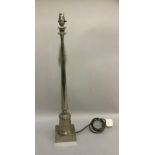 A stainless steel column table lamp with tapered column and on square base, approximately 72cm to