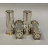 Two pairs of silver salt and pepper shakers each in the form of a twelve gauge shotgun cartridge,