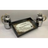 A mirrored and black two-handled tray, rectangular, printed with Grande Champagne, together with two