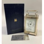 A carriage clock in silver case by Ogdens of Harrogate, Royal Hall Restoration Trust time piece with