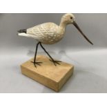 A carved wood figure of a black tailed godwit, wading bird, on wooden block plinth, 25cm high