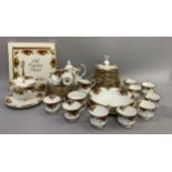 A Royal Albert Old Country Roses tea service comprising teapot and stand, sugar and cream, twelve
