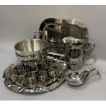A set of six individual stainless steel and brass handled saucepans, various platters and trays,