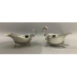 Two silver sauceboats both with three pad feet and C scroll handles, Birmingham 1934 for SB & Co and