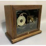 A Pul-Syn-Etic Impulse clock in mahogany veneered case with glazed door, made by Gents