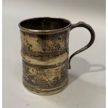 An Edward VII silver tankard of girdled form with C scroll handle, hallmarked London 1906 for Josiah