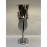 A polished steel champagne bucket and stand, 87cm high