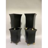 A set of four black planters with git highlighted rope twist rims, on paw feet, 35cm high x 24cm