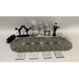 A five light silver plated candelabra, diamante and mirrored coasters, a silver beaded table runner,