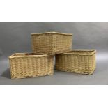 A set of three wicker baskets, 59cm x 44cm x 30cm high