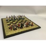 A chess set of Napoleon & Wellington figures and a chess board