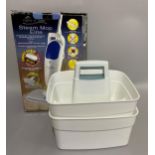 A Steam Mop Elite in original box together with two cleaning product carry baskets
