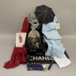 A Chanel mat, a cosmetic case, two pairs of white jeans (unworn), Venetian opera masks, together