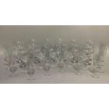 A selection of plain table glass including a set of twelve champagne coups, six cocktail glasses,