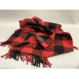 A Joshua Ellis and Co Ltd 100% cashmere travel rug in red and black check