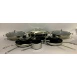 A quantity of Marks & Spencer, Lakeland and other sauce pans, fish kettle, woks, frying pans, etc.