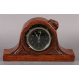 THOMPSON OF KILBURN 'MOUSEMAN', an early oak mantel clock, c.1930s, of arched outline, carved in