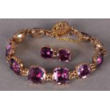 A SUITE OF EARLY VICTORIAN AMETHYST BRACELET AND BROOCH in 15ct gold, each bracelet link with a