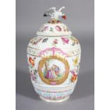 A DRESDEN CHINA VASE AND DOMED COVER WITH EAGLE SURMOUNT, the oval reeded body polychrome painted