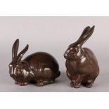 A PAIR OF JAPANESE OKIMONO AS TWO BROWN PATINATED BRONZE RABBITS, Taisho period (1912-1926), one