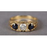 A SAPPHIRE AND DIAMOND THREE STONE RING set to the centre with a brilliant cut diamond flanked by