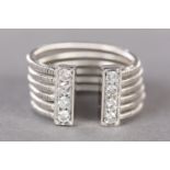 A DIAMOND DRESS RING by David Morris in 18ct white gold, the brilliant cut stones grain set to