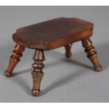 AN EARLY 19TH CENTURY MINIATURE YEW-WOOD STOOL, the rectangular top with curved cut corners, on