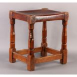 THOMPSON OF KILBURN 'MOUSEMAN', an early oak and hide upholstered stool, c.1930-40, on turned