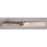 A VICTORIAN SILVER LEOPARD HEAD HANDLED MOTHER-OF-PEARL PAGE TURNER, 19.5cm long, marks rubbed